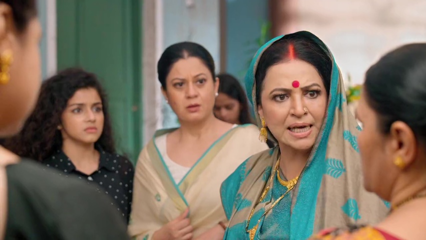 Sumitra looking sad as Geeta and neighbors gossip about Isha’s alleged crime