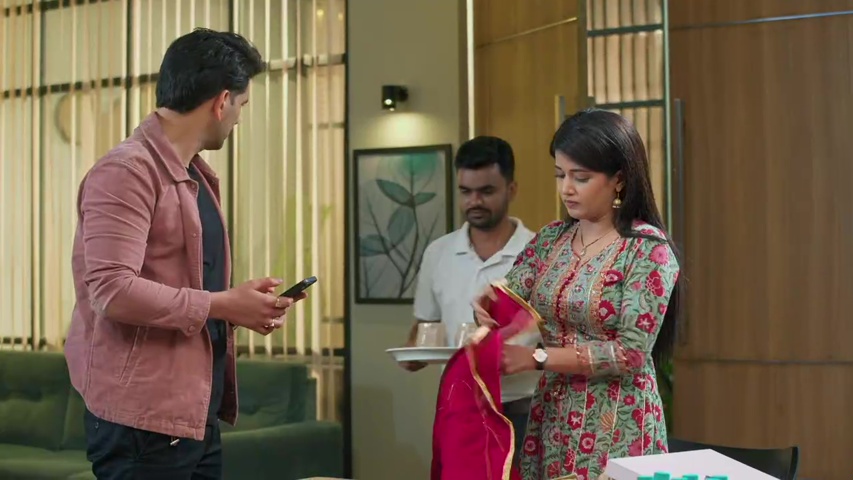 Abhira presenting her saree designs to Anshuman