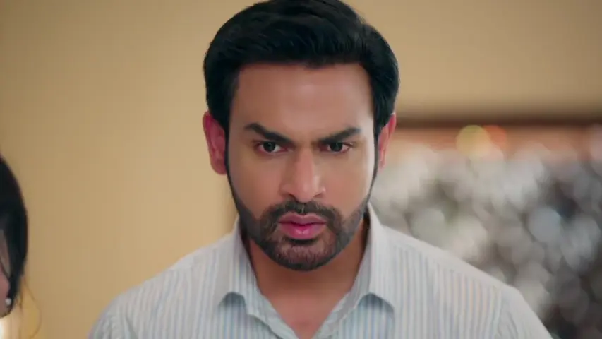 Adit angrily walking away from Sowmya as she pleads with him