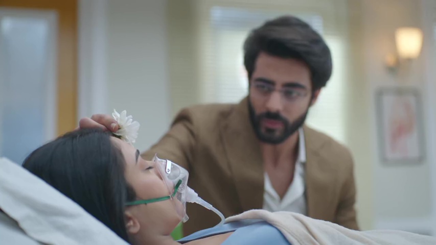 Aniruddh placing a pooja flower on Nutan’s forehead