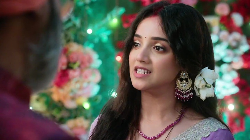 Anjali and Raghav talking intensely in the Rajput household