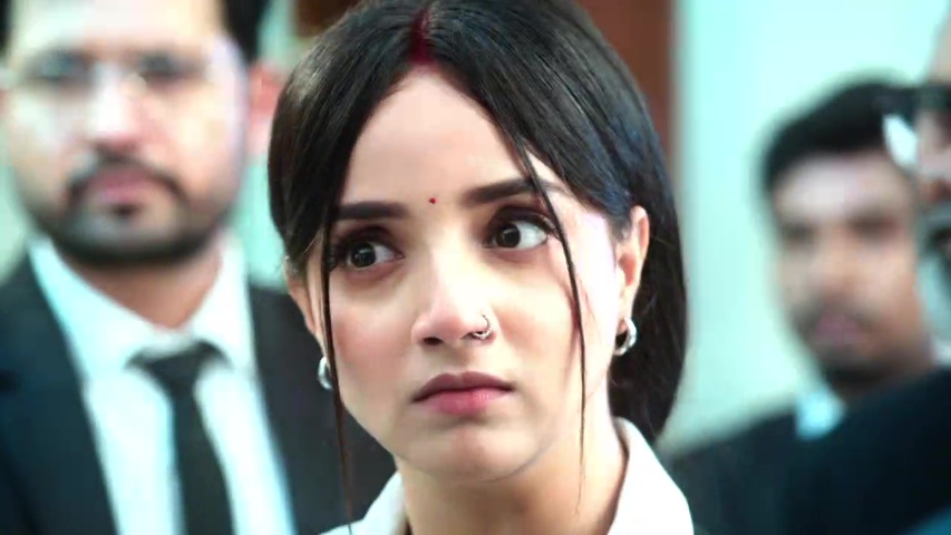Anjali standing confidently in the courtroom facing Raghav