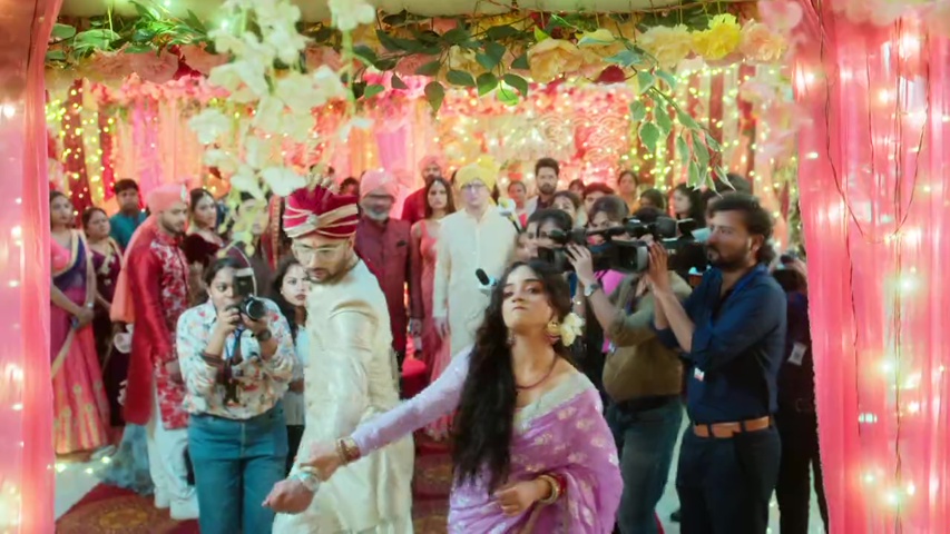 Anjali standing tall as she throws Yuvraj out, with the crowd watching