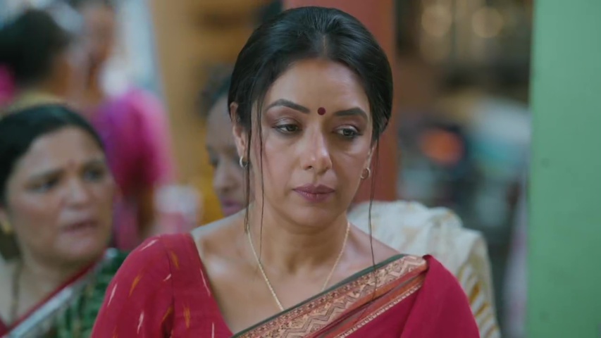 Anupama standing confidently at the water line