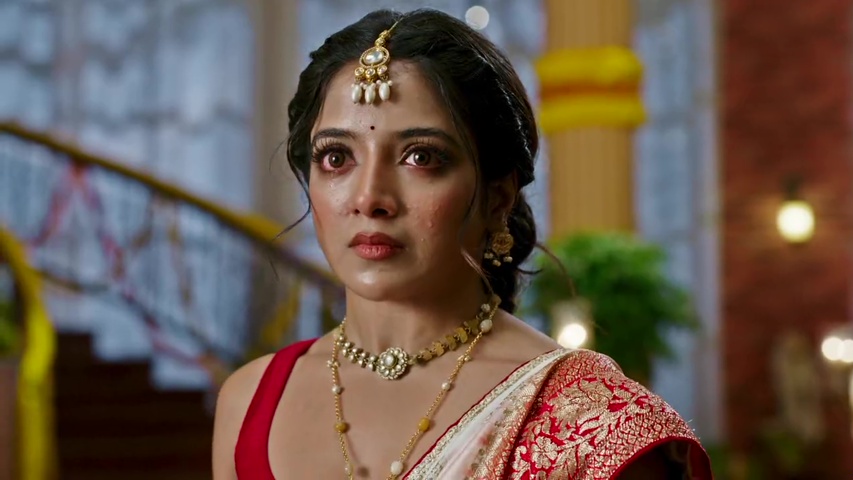 Gauri standing up to Mohana with a fierce expression