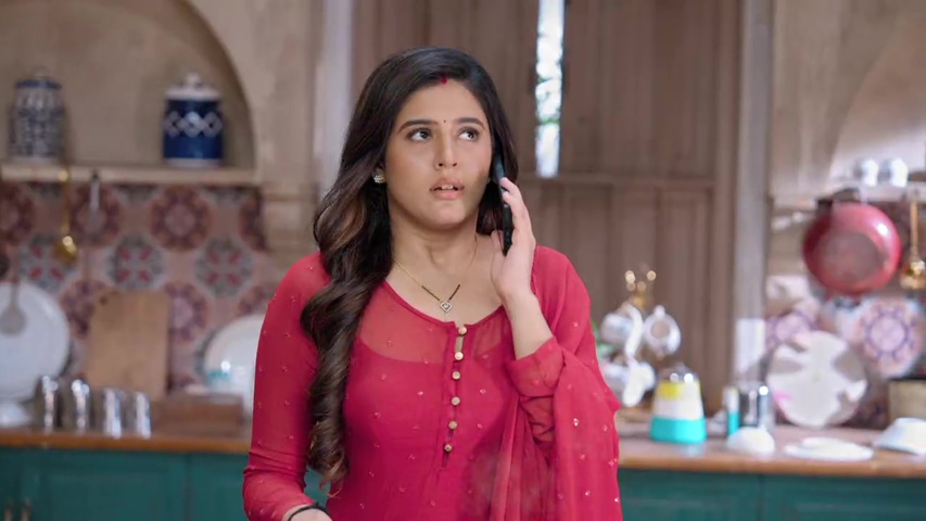 Isha looking worried as she searches for jobs on her phone