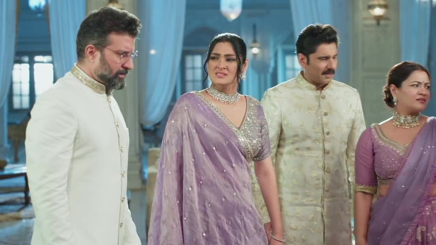 Kajal and Sanjay arguing in the family scene