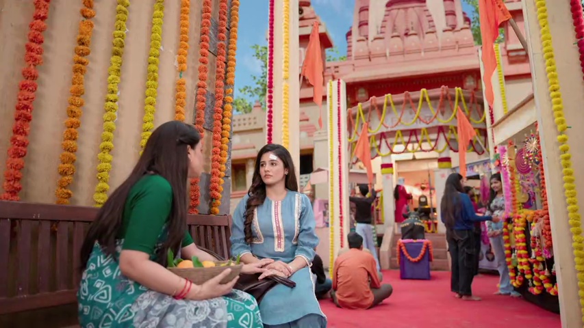 Mala and Isha talking at the mandir