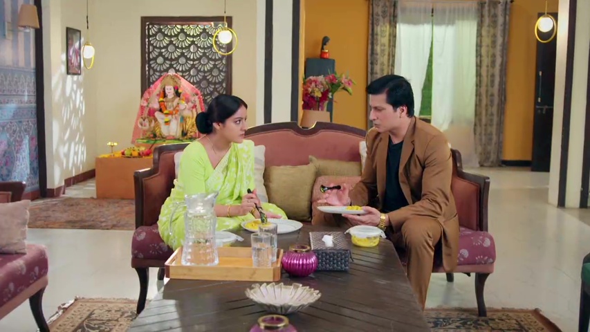 Mangal and Kapil sharing a meal and talking