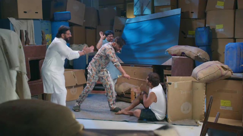 Manoj angrily confronting Kabir in the godown