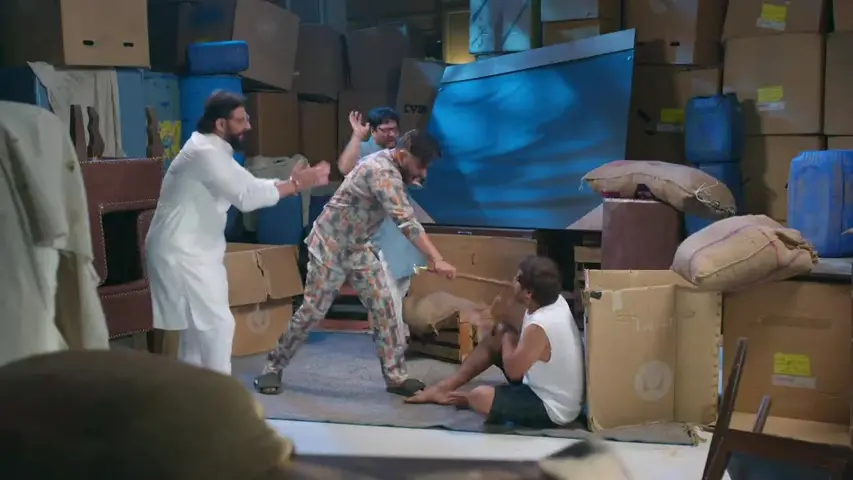 Manoj angrily confronting Kabir in the godown