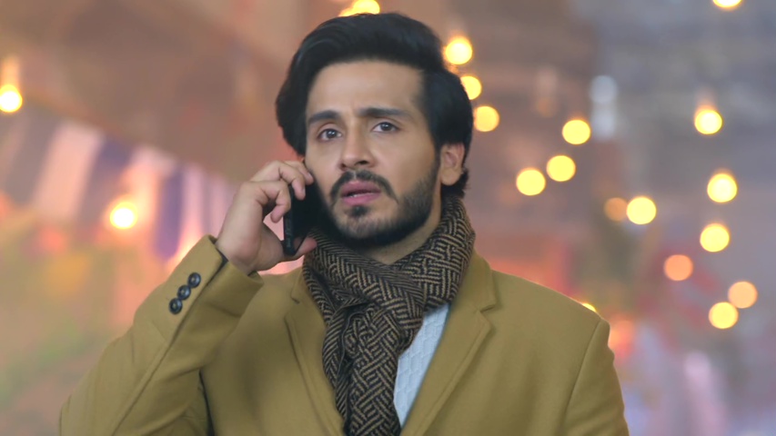 Neil on the phone, looking serious, as he investigates Ridhi’s identity