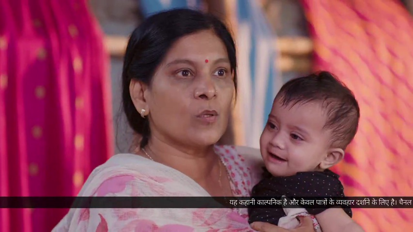 Nimmo holding Preeth, looking secretive as she talks to Bebe