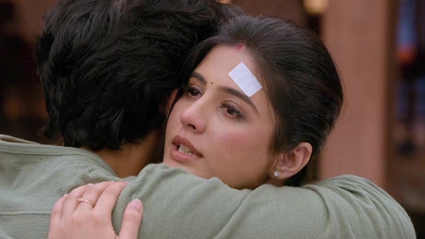 Om and Isha sharing an emotional hug