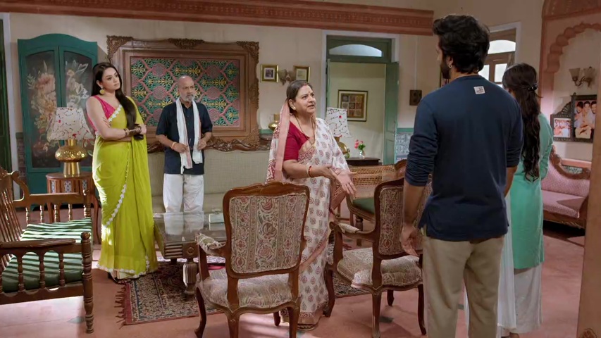 Om and Isha talking to Janki and Acharya, looking tense but united