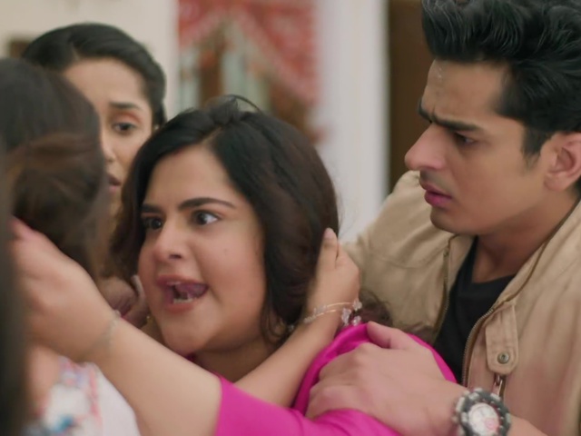 Pari and Raja standing together, facing Ishani during the argument