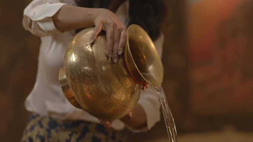 Rajnandini pouring water on the havan