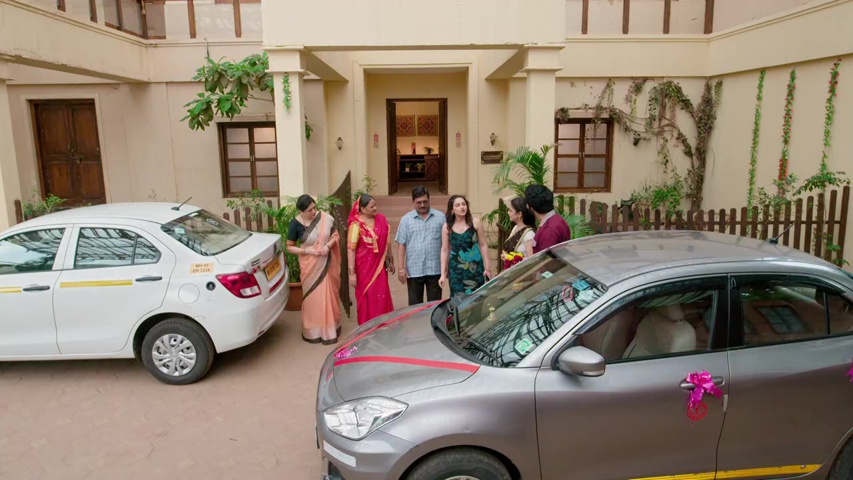 Sachin showing the new car to the family