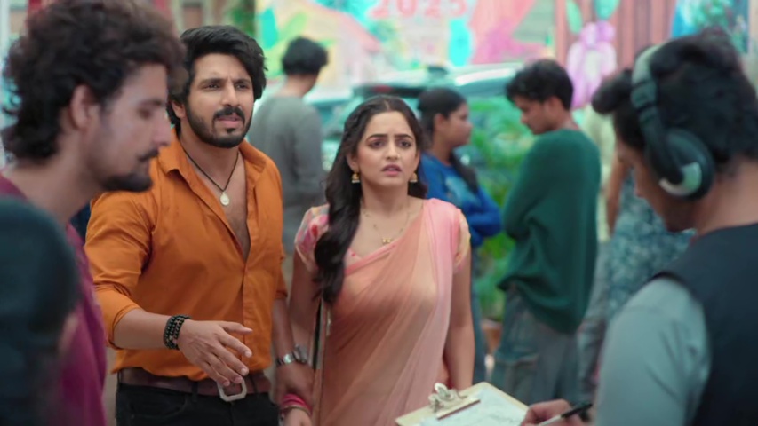 Sayali and Sachin at the flea market gate, looking hopeful