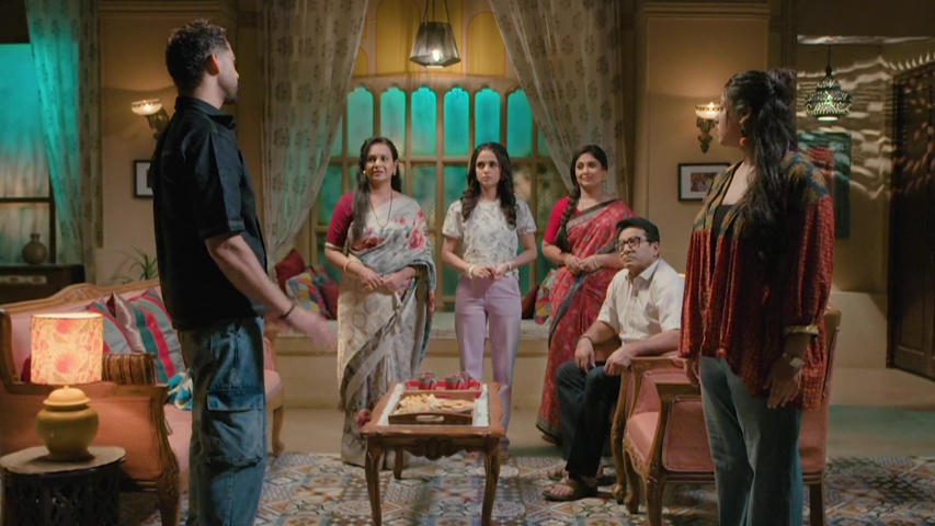 Bhavya and Rishank talking seriously in a cozy room